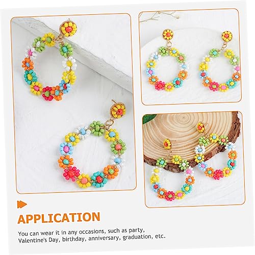 Boucles d'oreilles perle fleur pour sublimer une coiffure de mariage bohème