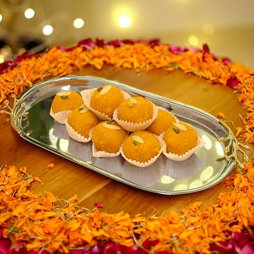 Image of BEHOMA Golden Twig Oval Serving Platter, 13 inch | Oval stainless steel platter with brass leaf handle, 13 inch; elegant serveware for Navratri & Durga Puja.