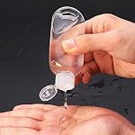 50 PCS Travel Plastic Clear Keychain Bottles, Hand sanitizer Bottle containers, Leakproof Refillable Empty Bottles Portable Squeeze Containers with Flip Cap(50ml/1.7oz)