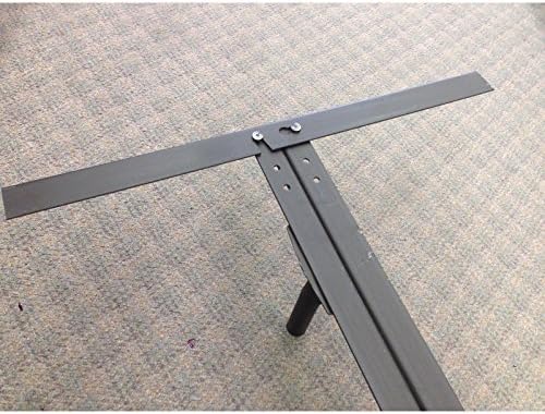 Kitas view of the bed frame assembly, showing a crossbar being inserted.