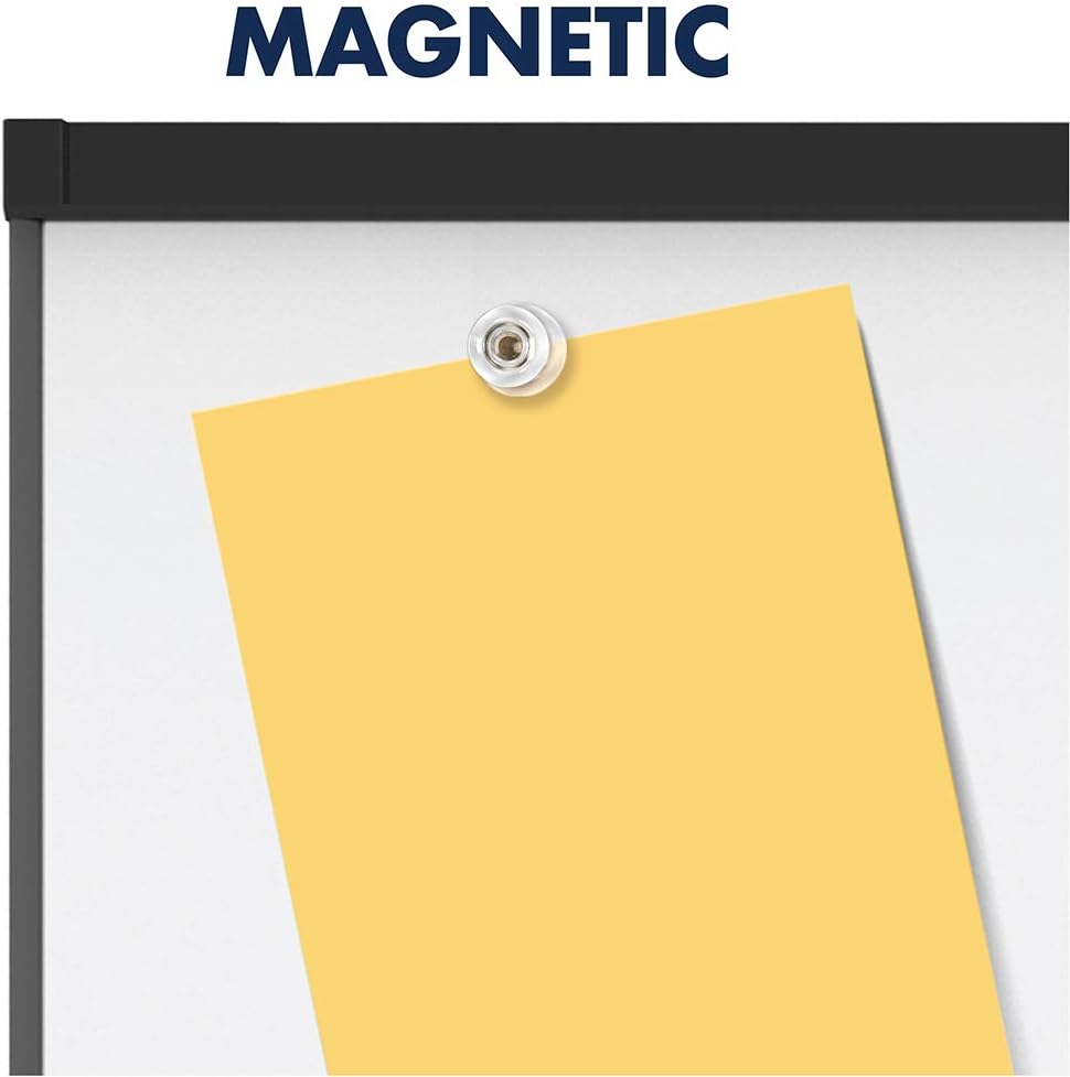 A magnet holding a yellow note on the whiteboard surface