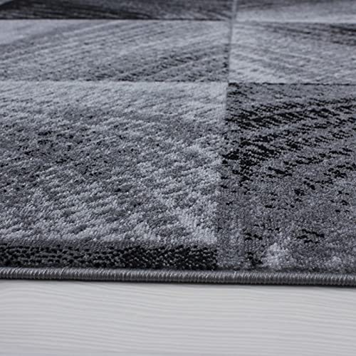 Tapis de salon moderne à vagues noir pour structurer un grand séjour - 2