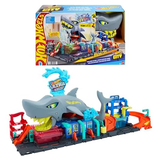 Hot Wheels 'Let's Race' Netflix - Mega Squalo Autolavaggio, pista con rullo di schiuma e cancelli mobili, funzione cambia colore e macchinina Color Reveal inclusa, 3+ anni, HTN82