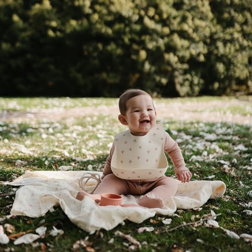 Image of mushie Silicone Baby Bib | Adjustable Fit Waterproof Bibs (Bows)