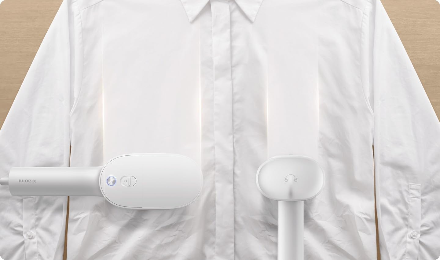Xiaomi Handheld Steam Iron being used horizontally on a white shirt