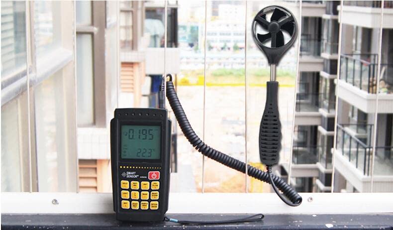 Anemometer measuring wind outdoors on a balcony