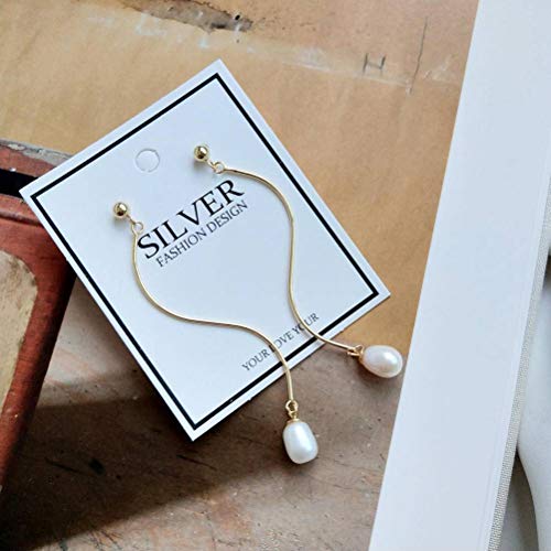 Boucles d'oreilles perles de riz et courbes fluides pour femme style pendant chic