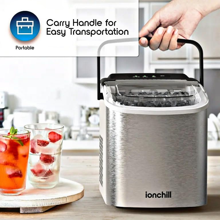 Hand holding ice maker by carry handle