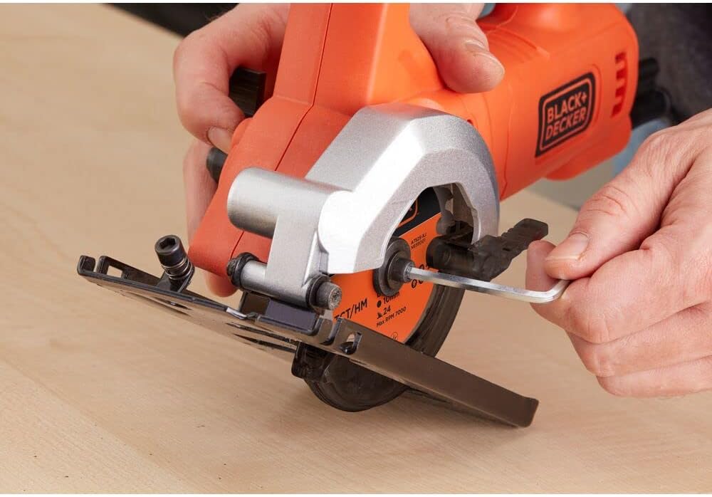 User changing blade on BLACK+DECKER Mini Circular Saw