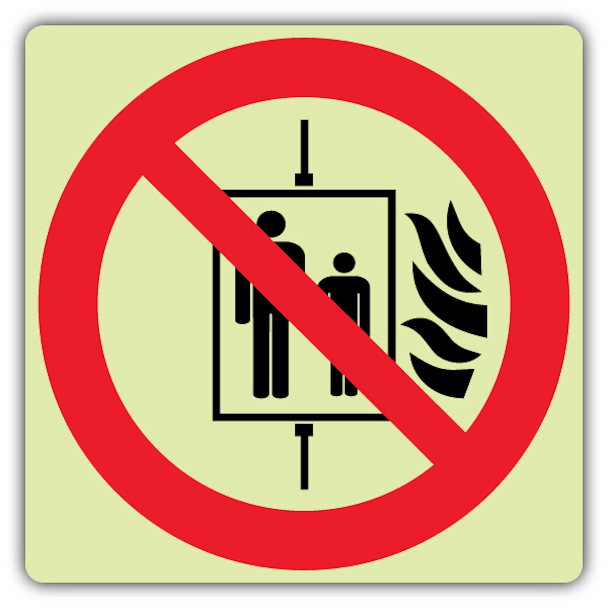 Cartello con simbolo "V Safety Glow In The Dark In The Event Of Fire Do Not Use This Lift", formato simbolo, 450 x 450 mm, realizzato in vinile autoadesivo triplo fosforescente, segnaletica