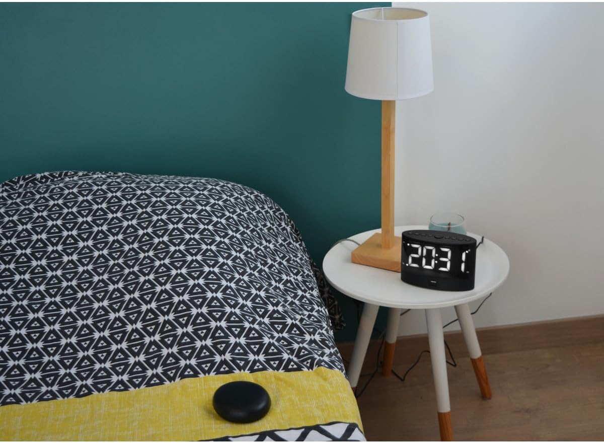 Orium 11304 Alarm Clock on a bedside table
