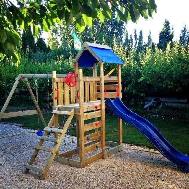 WICKEY Wooden climbing frame MultiFlyer with swing set & green slide, Outdoor kids playhouse with sandpit, climbing ladder & play-accessories for the garden