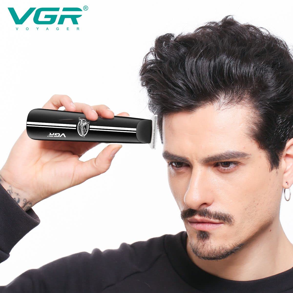 A man using the VGR V-007 trimmer to trim his hair, demonstrating typical usage.