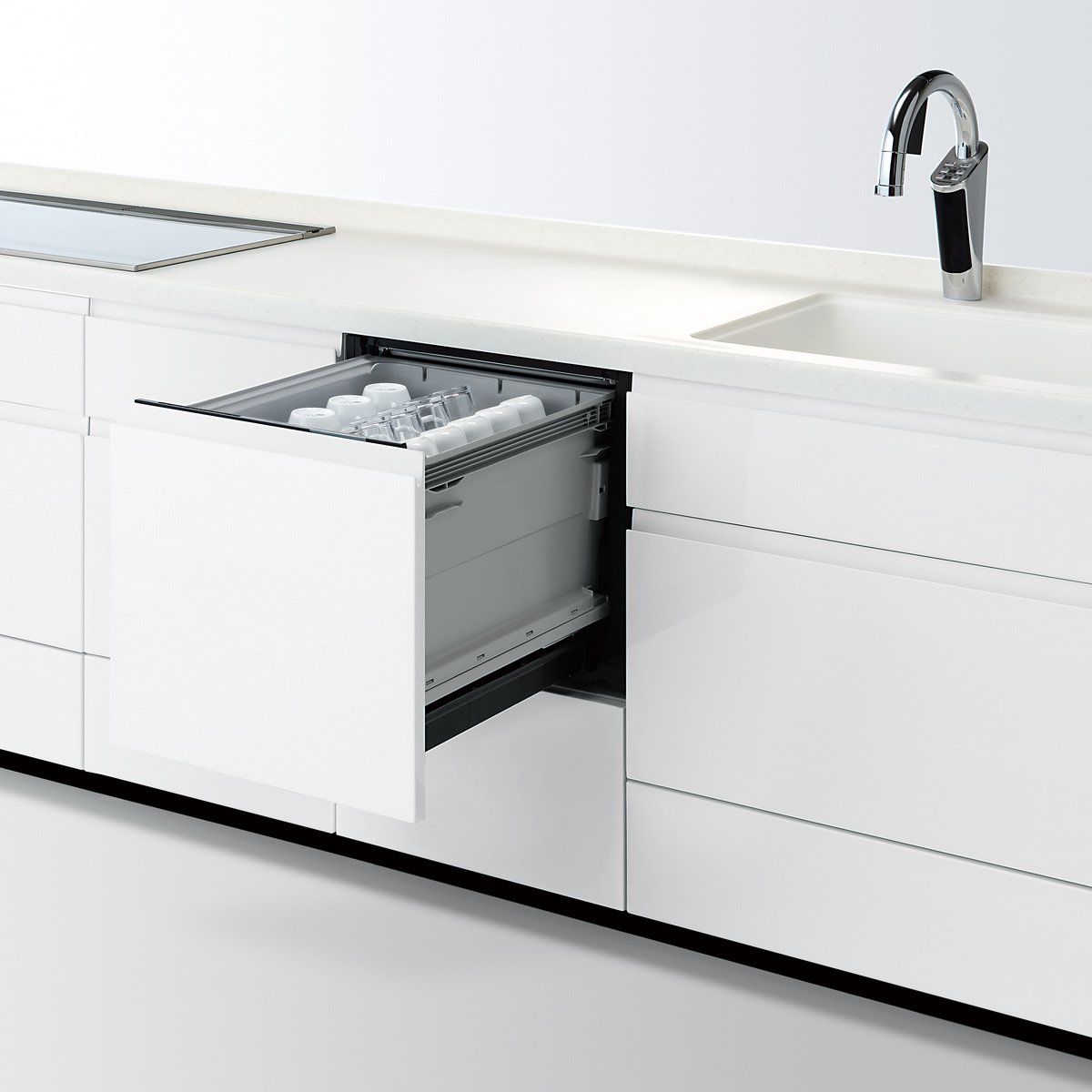 Panasonic NP-45KS8W dishwasher drawer open, loaded with various dishes and cups.