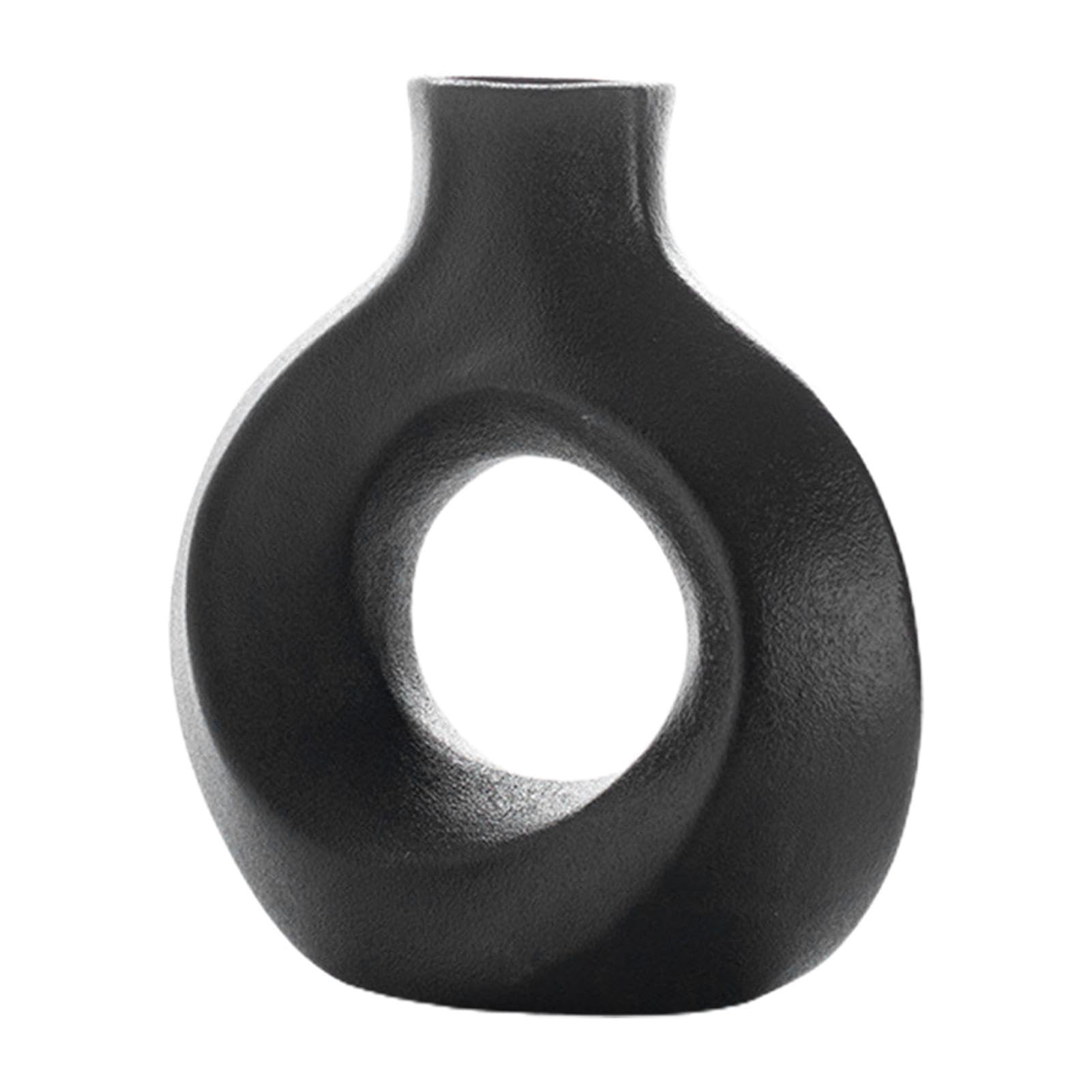 Vase rond céramique blanc pour illuminer un intérieur minimaliste