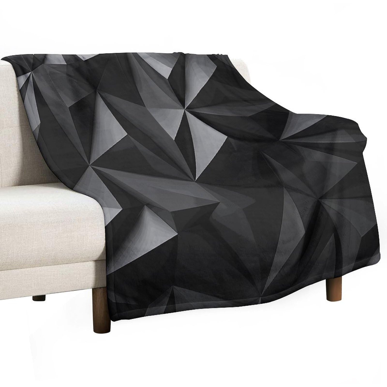 Couverture polaire noire motif géométrique pour vos soirées cocooning canapé