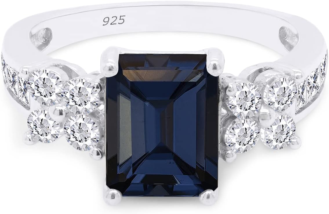 SAVEARTH DIAMONDS 8x6MM Emerald Cut Simulated Blue Sapphire With Princess & Round Cut Sparkling White Cubic Zirconia Cluster Engagement Ring For Women In 14k Gold Over Sterling Silver