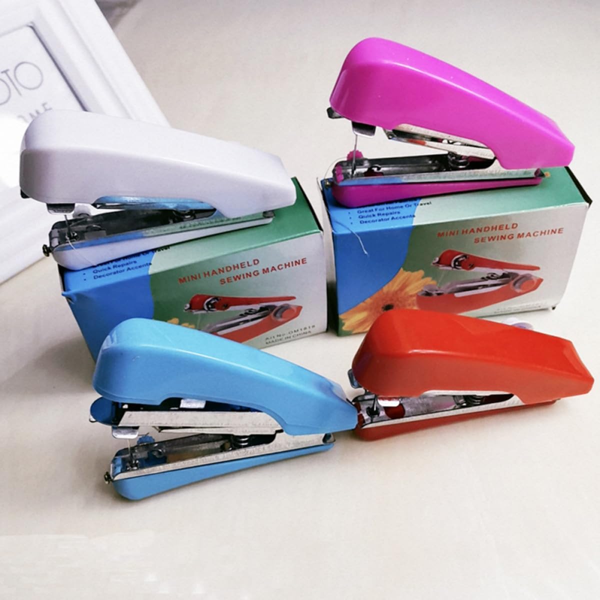 FUOYLOO Mini Handheld Sewing Machine Portable Mending Tool Kit for Home and Travel, 4 Colors (blue, White, Red, Pink) Compact Manual Sewing Device for DIY Clothes Repairs and Crafts