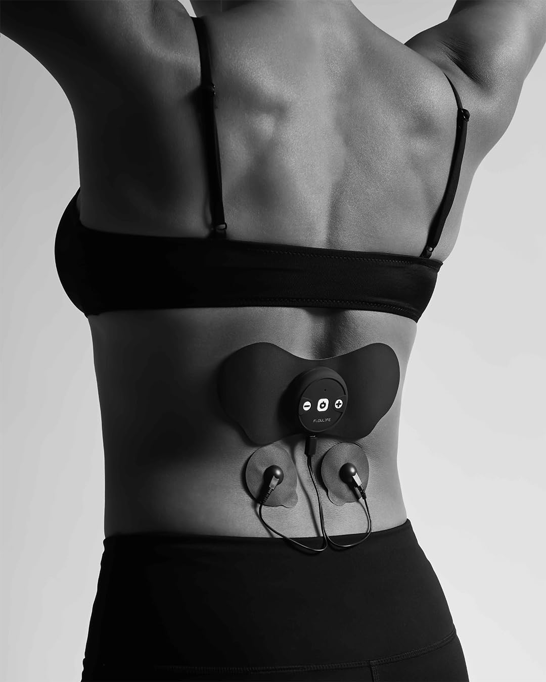 Flowlife Flowtens Connect device applied to a person's lower back