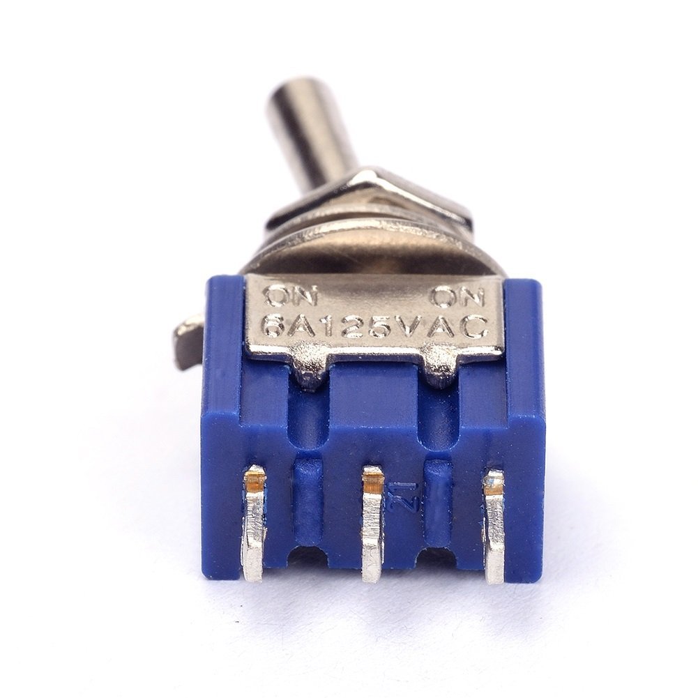 Close-up view of the three terminals on the underside of a HiLetgo MTS102 toggle switch.