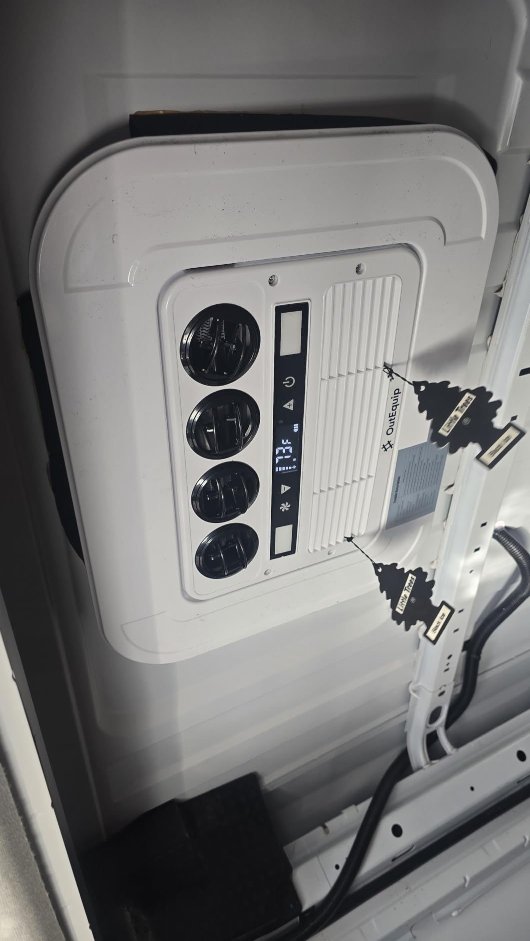 OutEquip installed on DIY camper van roof, 5-star verified Amazon review praising DC battery compatibility, low profile clearance, and off-grid solar system efficiency