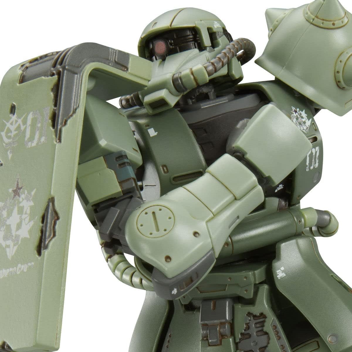 Close-up view of the HG 1/144 MS-06F Cucuruz Doan's Zaku holding its shield, showing battle damage details.