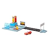 Disney and Pixar Cars On The Road Dinoco Rusteze Racing Center Playset with Lightning McQueen Toy Car, Launcher, Short Track and Spinning Pitty, Toy Gift for Kids, HGV69