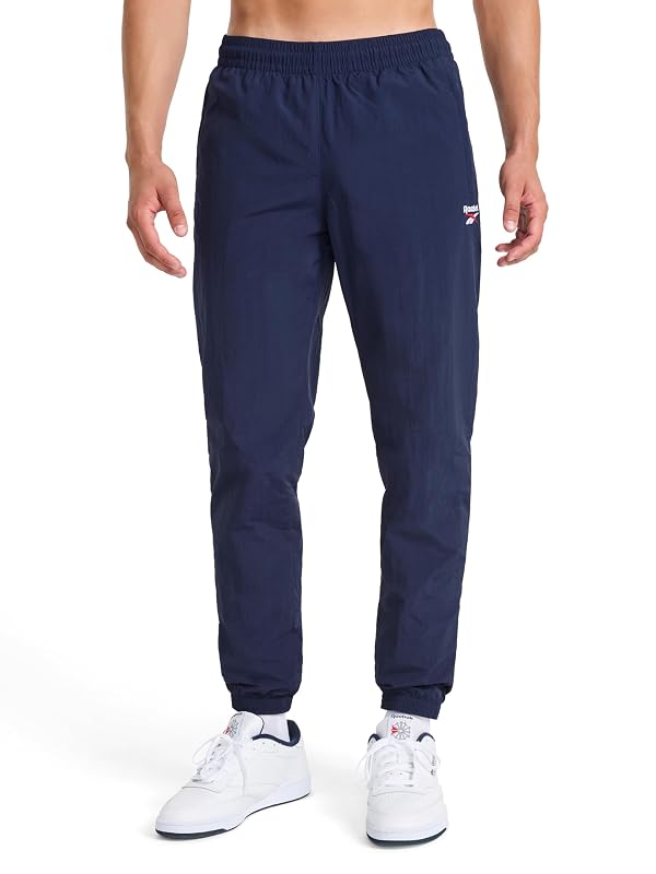 Reebok Men’s Track Pant, Standard Fit, 31” Inseam, Lightweight Nylon Fabric, Vector Navy, Medium by Reebok - Used condition - US$43.81