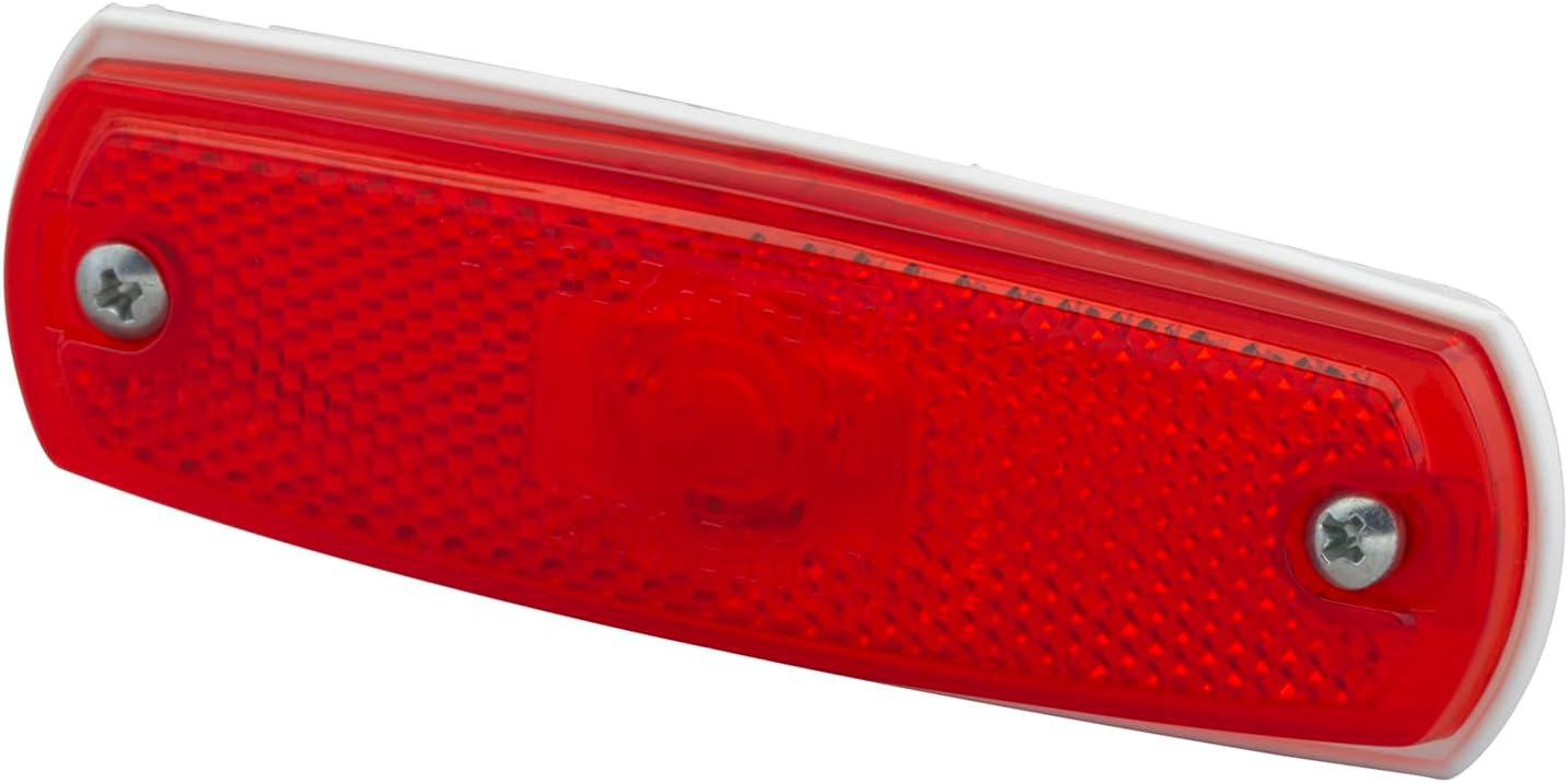 Front view of the Grote 47262 LED clearance marker light, illustrating its low-profile design and red lens.