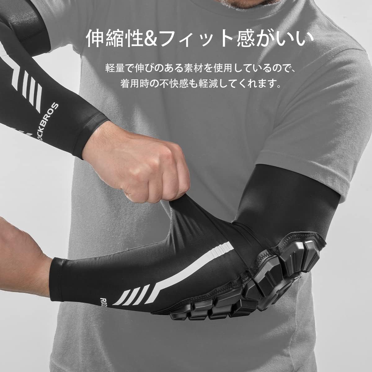Person stretching the arm sleeve to demonstrate its elasticity and snug fit.