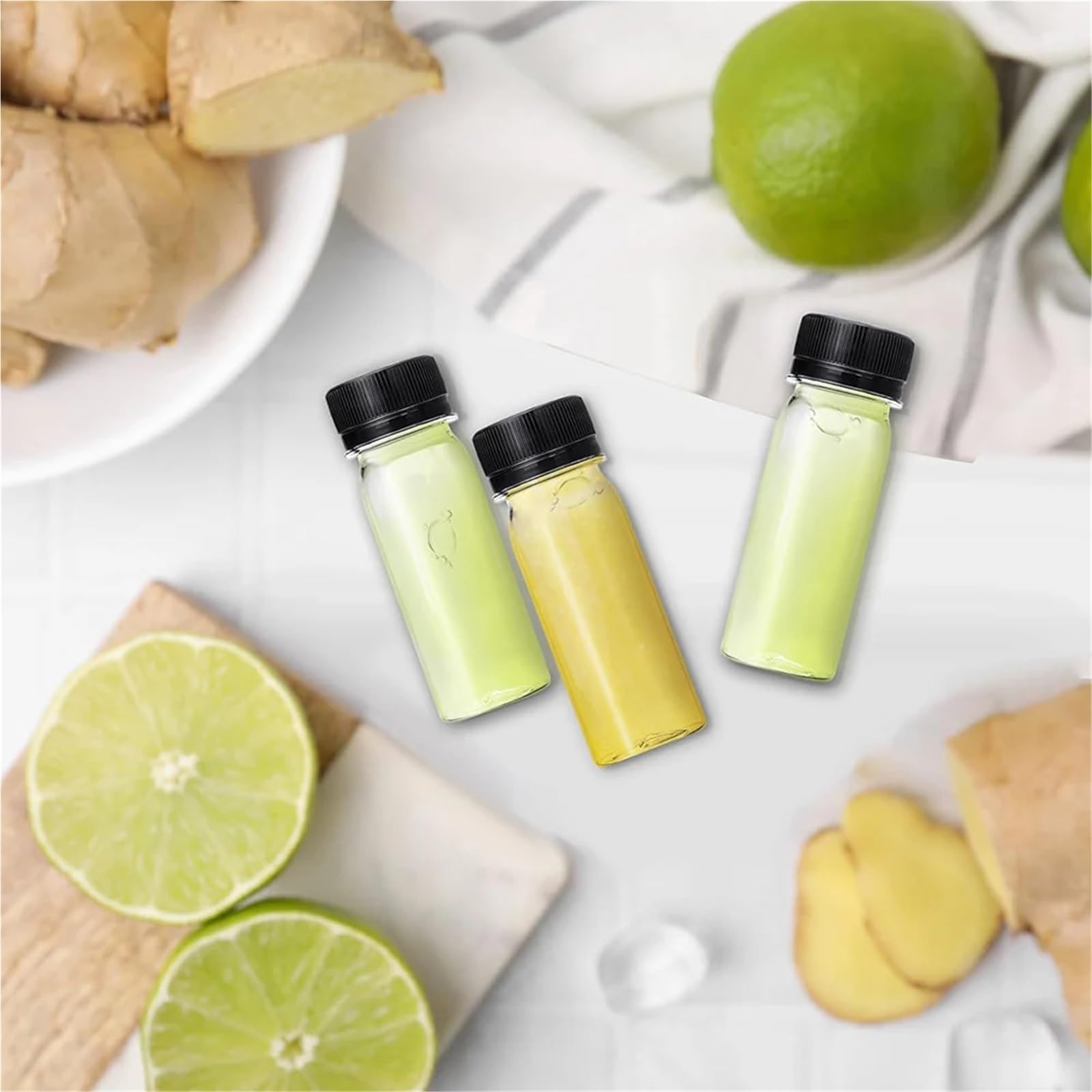 Saftflaschen 10/24/50/75/165 Stück 2 oz kleine Plastikflaschen for Flüssigkeiten, Ingwer-Shot-Flasche mit Deckel, wiederverwendbare Getränkebehälter(75PCS)