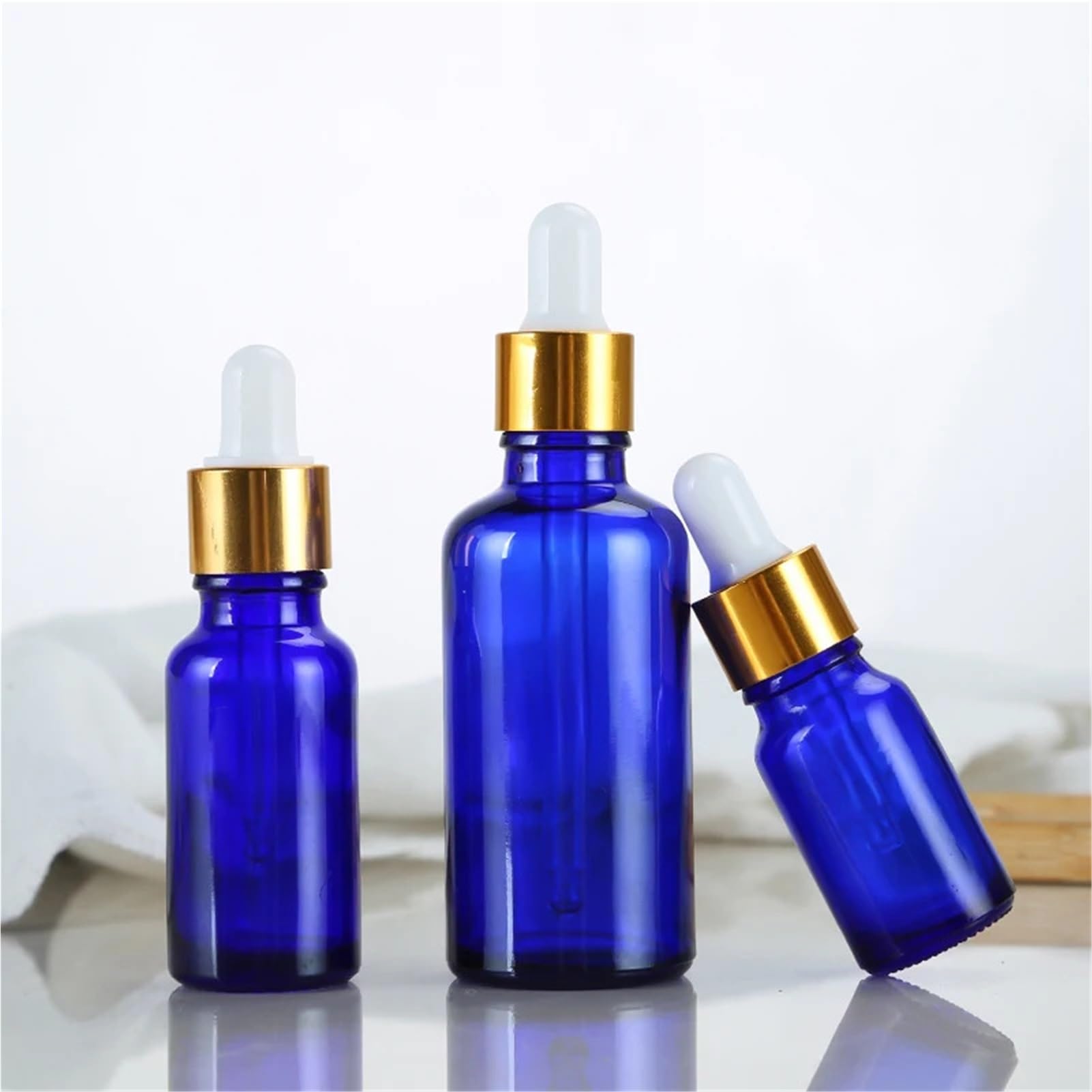 10 unids/lote de 5ml a 100ml, botella de aceite refinado de vidrio redondo azul de laboratorio con goteros de vidrio, círculo dorado for experimentos escolares(100ml)