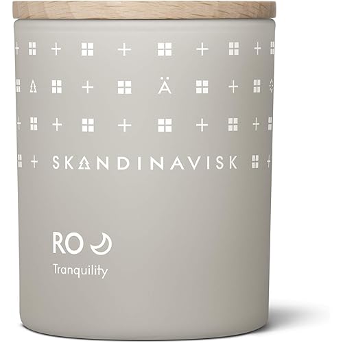 Skandinavisk RO 'Tranquility' Mini Scented Candle. Fragrance Notes: Cut Grass and Fallen Leaves, Cucumber and Wild Violets. 2.3 oz.