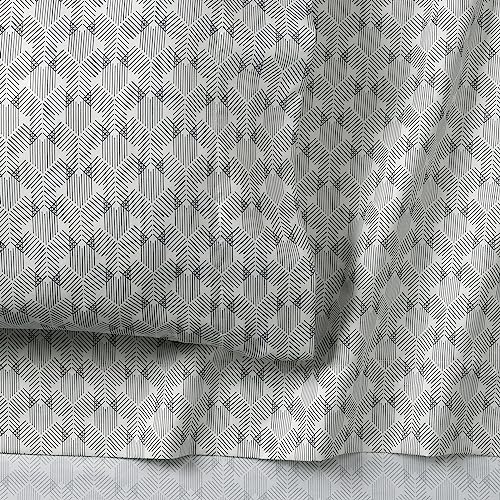 Parure de lit réversible 7 pièces NINE WEST pour harmoniser un lit facilement