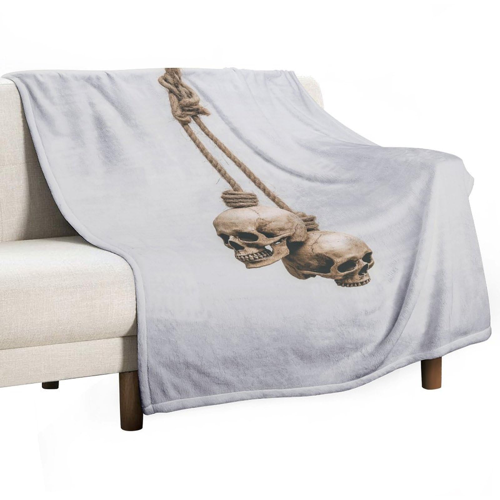 Couverture anti-boulochage crânes pour vos soirées cocooning et instants détente au salon