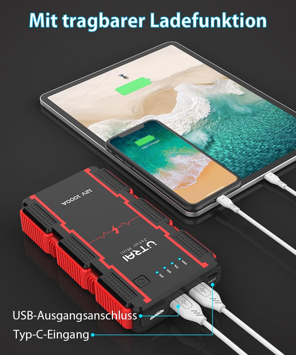 UTRAI Jstar Mini jump starter charging a smartphone and tablet via its USB ports.