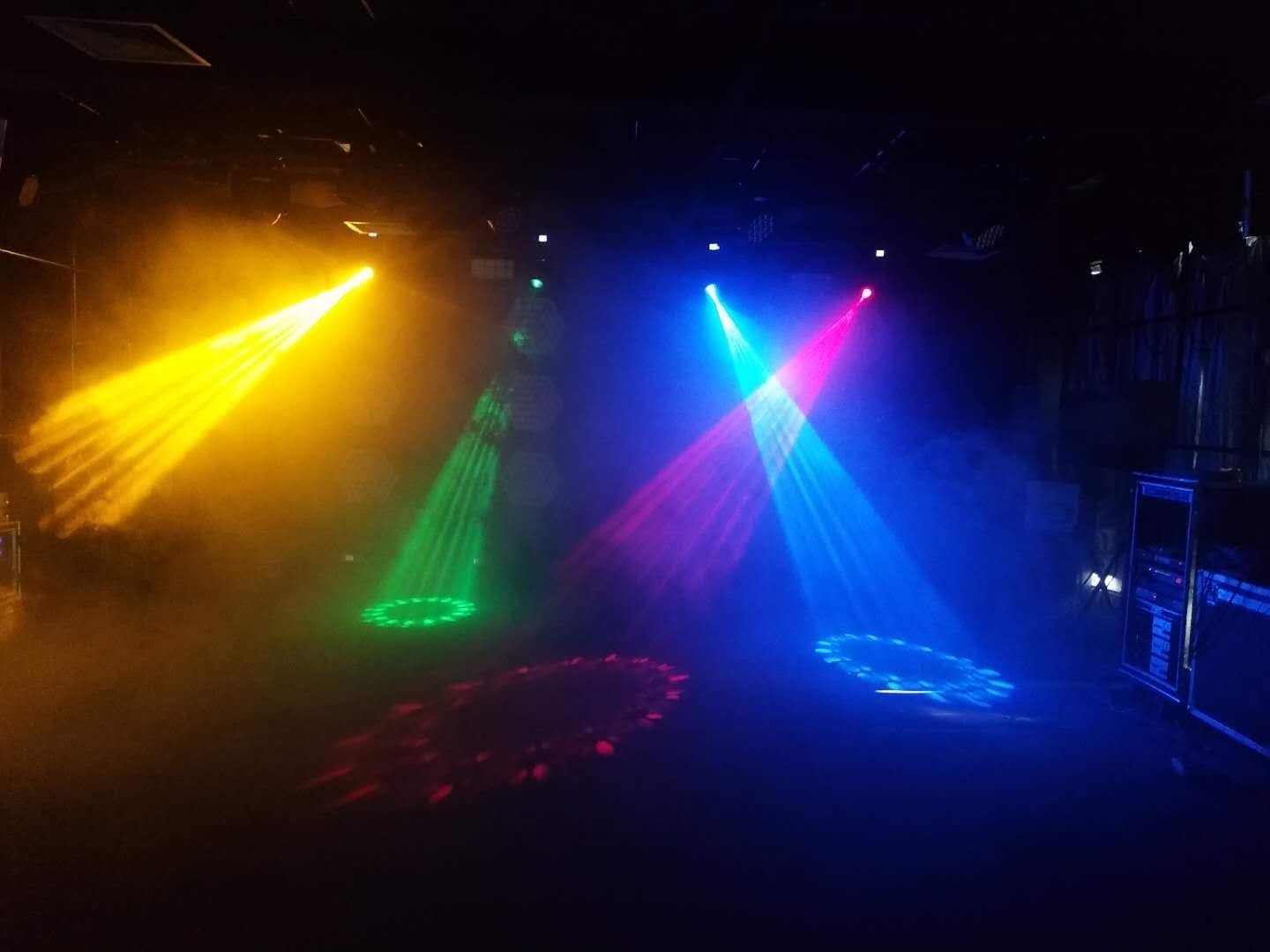 Stage lighting with multiple colored beams from moving head lights