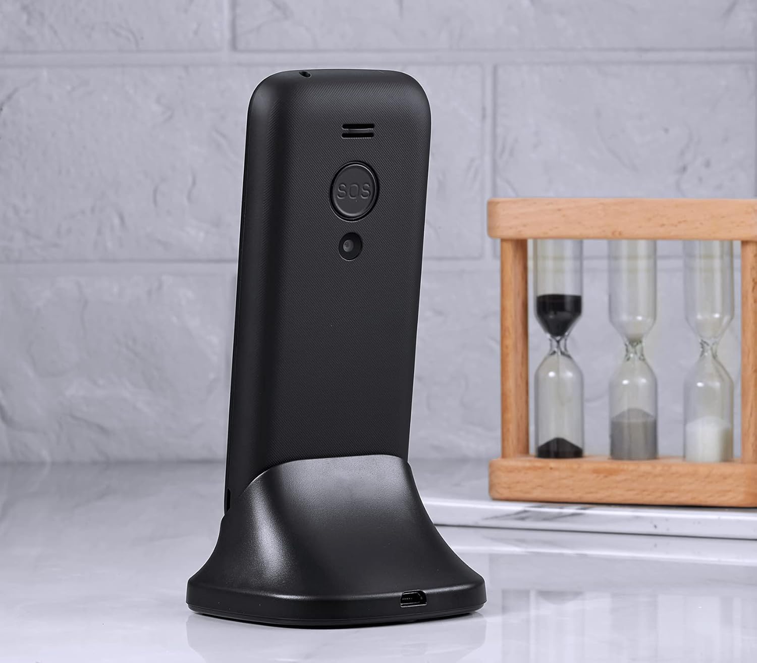 TOKVIA T111 phone displaying the current time and date on its screen.