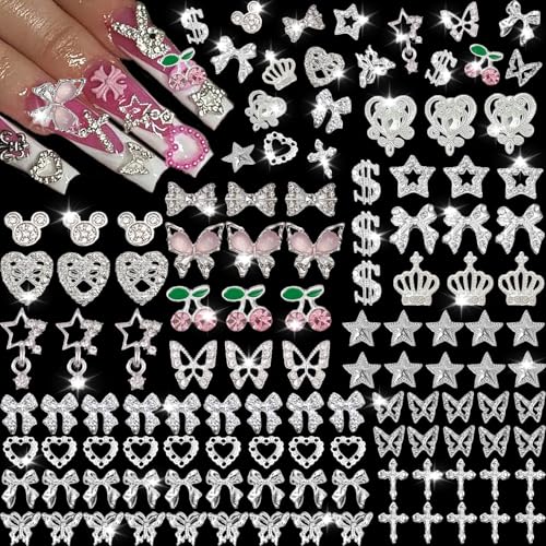 KACHIMOO 106 Pcs Nail Charms and Gems Silver Nail Charms Nail Rhinestones for Nails Design 3D Butterfly Bow Star Cherry Cross Dollar Heart Shapes for Acrylic Nails (19 Styles)