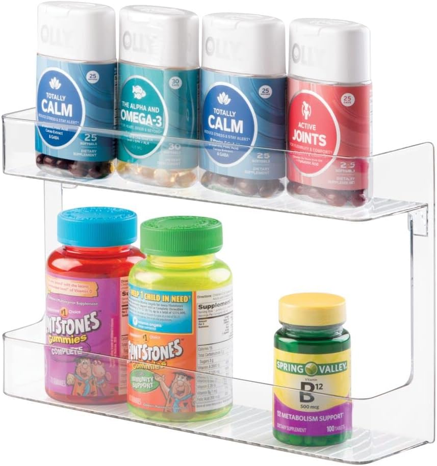 mDesign Plastic Wall Mount, 2 Tier Storage Organizer Shelf for Bathroom, Kitchen; Holds Vitamins, Supplements, Aspirin, Medicine Bottles, Nail Polish, Cosmetics and More, Ligne Collection - Clear