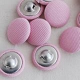 Estos botones con revestimiento de tela están fabricados a mano.