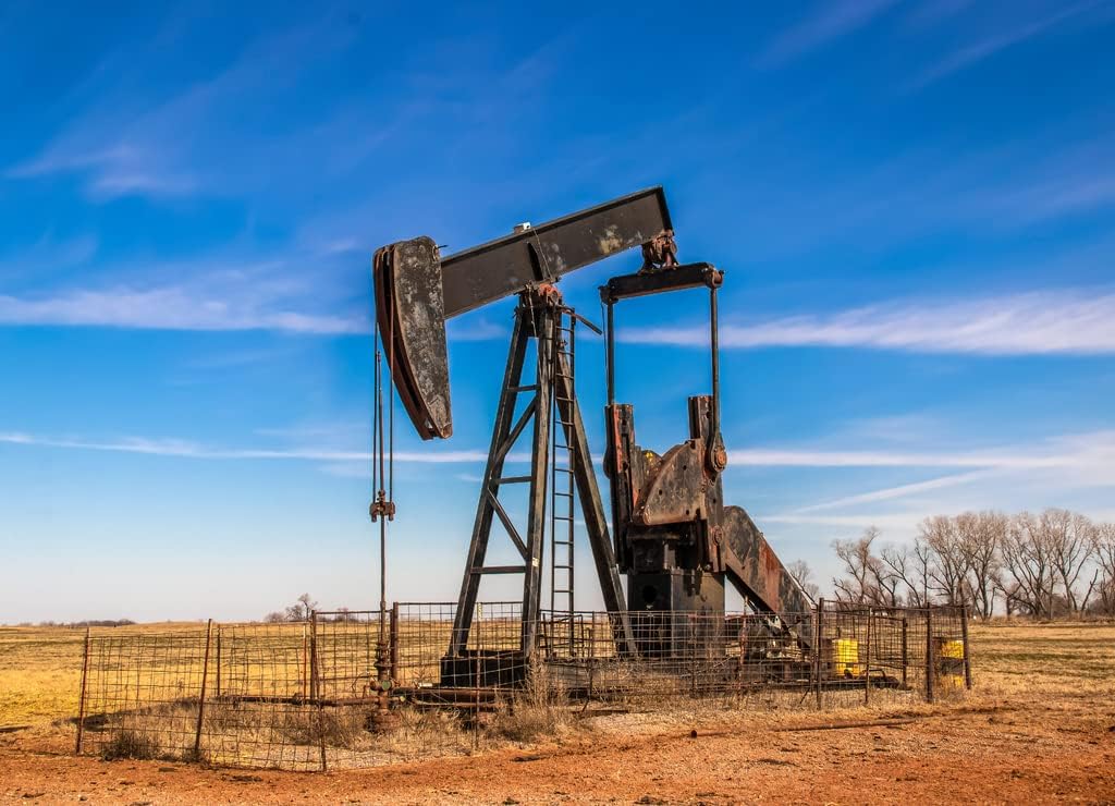Noah Jigsaw Puzzle Large Old Rusty Oil Well Pump Jack Surrounded by Cattle Panel Fence Out in Field, Oklahoma 1000 Pieces