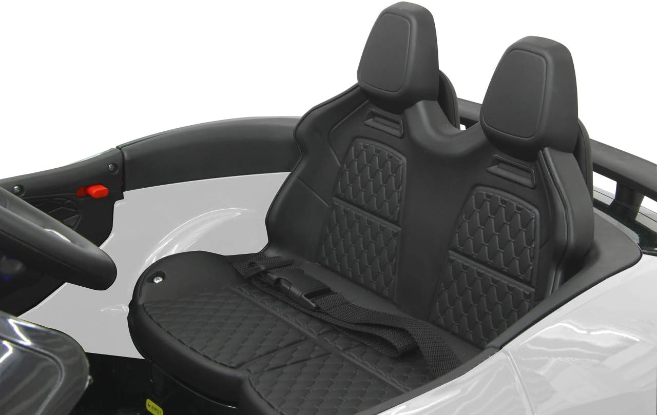 Interior view of the JAMARA Ride-on Jaguar F-type SVR, showing the seats and seatbelt