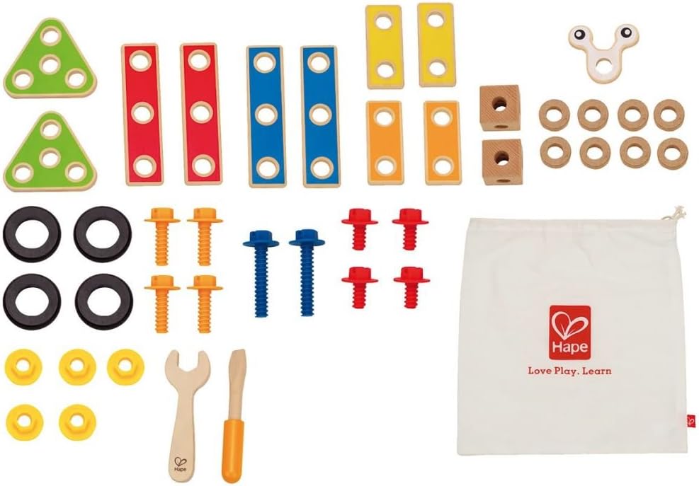 All 42 pieces of the Hape Basic Builder Set laid out, including wooden blocks, screws, nuts, wheels, and tools.