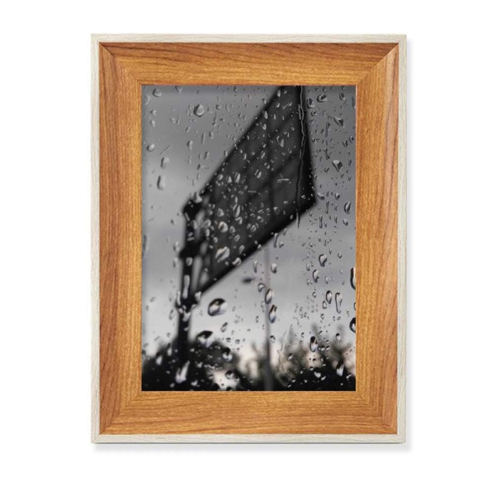 Marco de fotos de madera escritorio contra espacios vacíos set arte 1