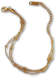 Multi Strand - A bracelet blending three or more gold-tone strands with bead accents, a layered chain silhouette, and an adjustable lobster clasp for a secure, versatile look for daily wear