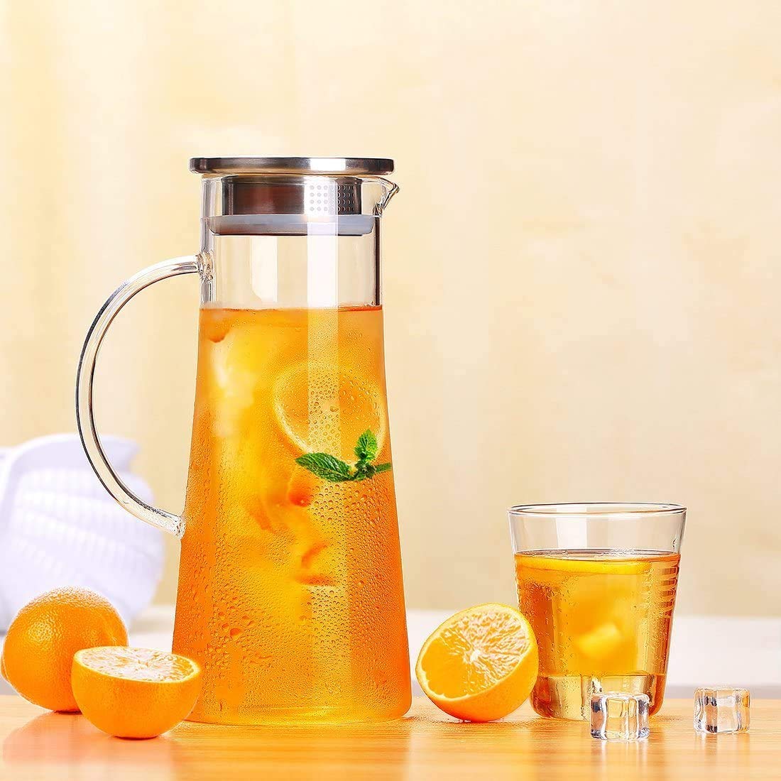 Parthiv 1.3L Borosilicate Glass Water Pitcher with Stainless Steel Lid and Infuser Jug for Hot and Cold Water, Iced Tea and Juice Beverage Carafe with Handle 1.3L Jug Pack of (4 pcs.)