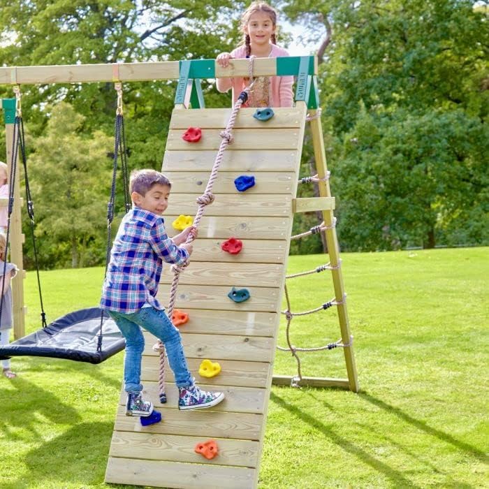 Child climbing the rock wall of the Rebo climbing frame
