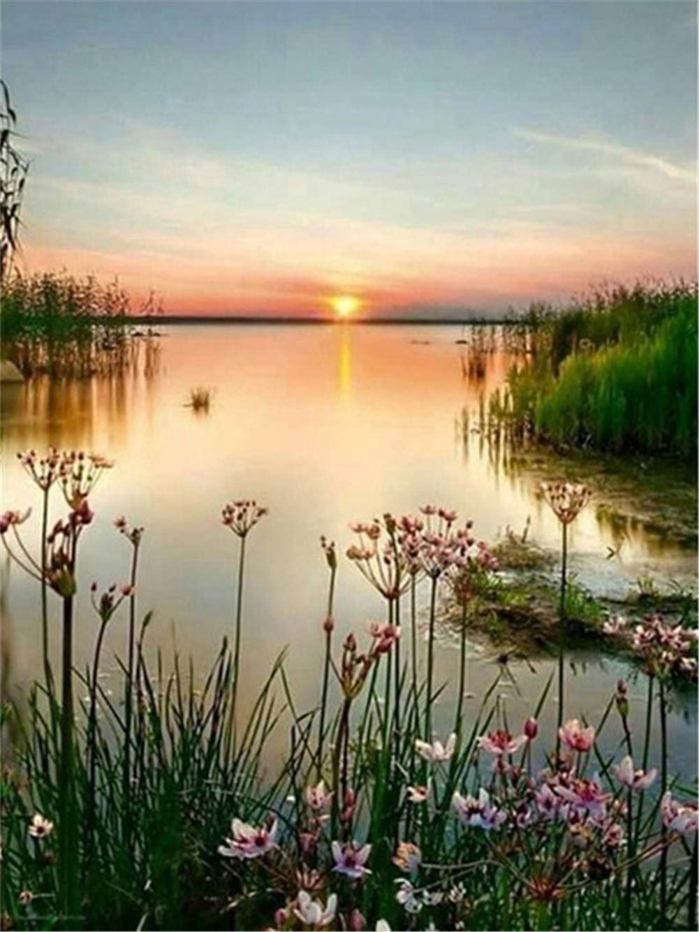 Diamant painting lac au coucher du soleil pour créer une décoration murale de salon zen