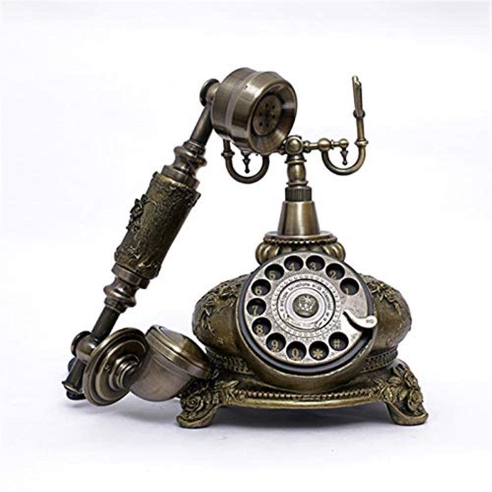 Telefon retro, replika telefonu zabytkowego, telefon stacjonarny retro, przewodowy, złoty, modny telefon z lat 60. z klasycznym obrotowym wybieraniem numerów.